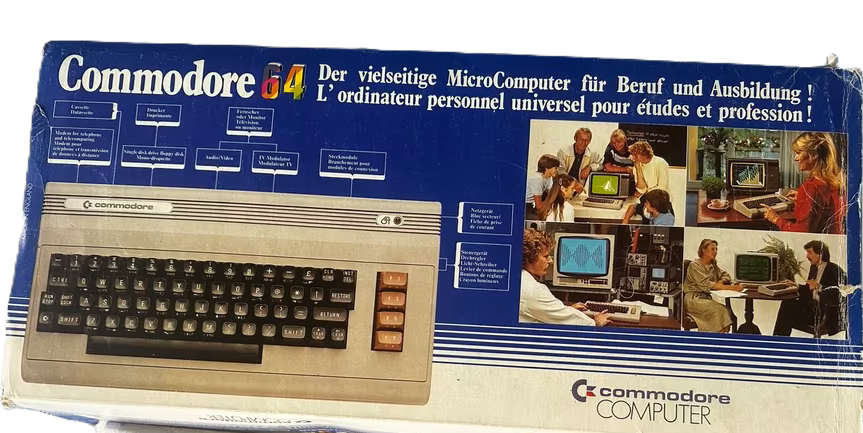 Erhaltener Commodore-64-Originalkarton mit deutscher und französischer Beschriftung sowie Anwendungsszenen